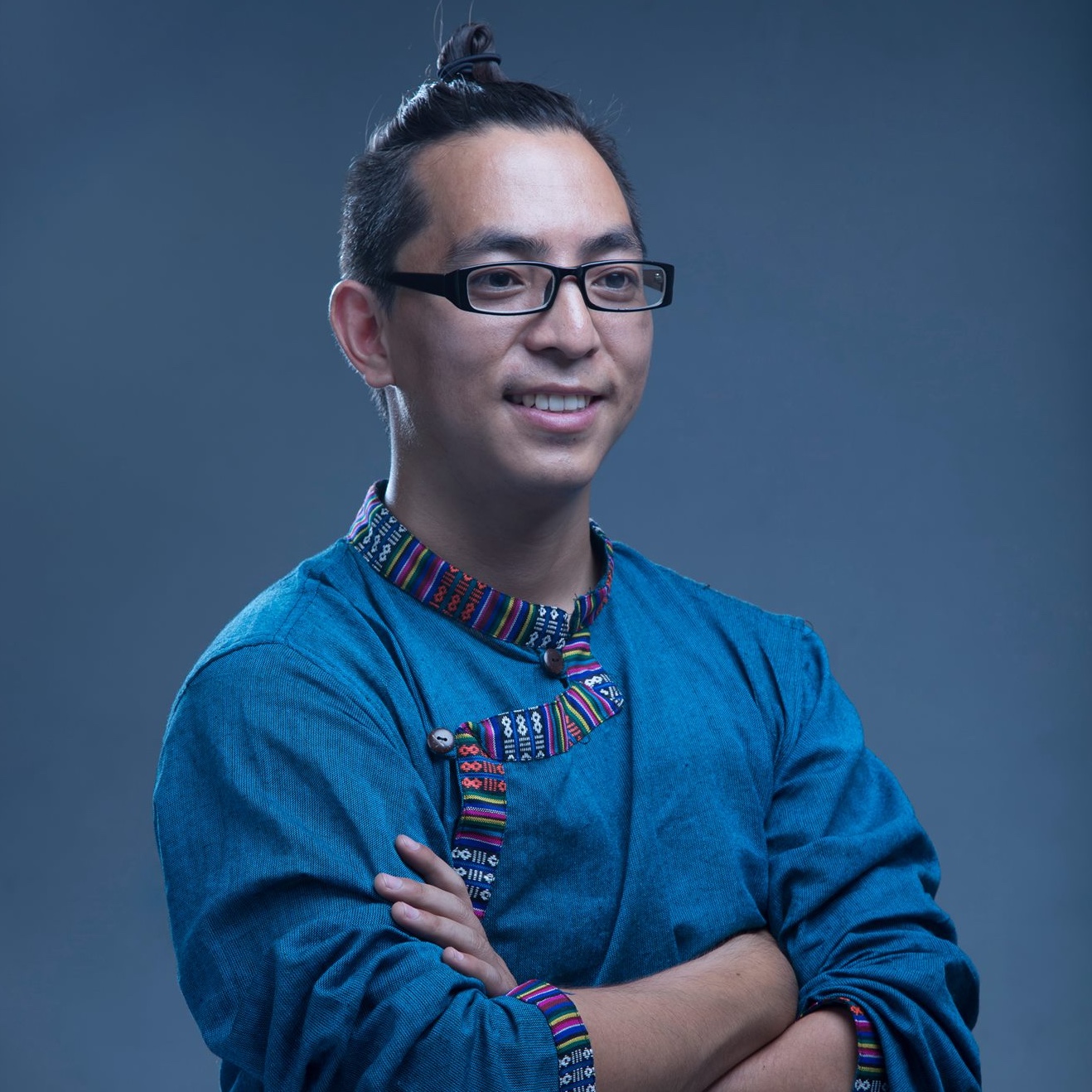 Headshot of Samyak Shertok smiling with arms crossed