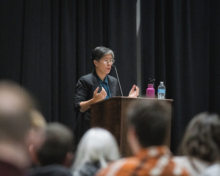 Lisa Ko reading at podium