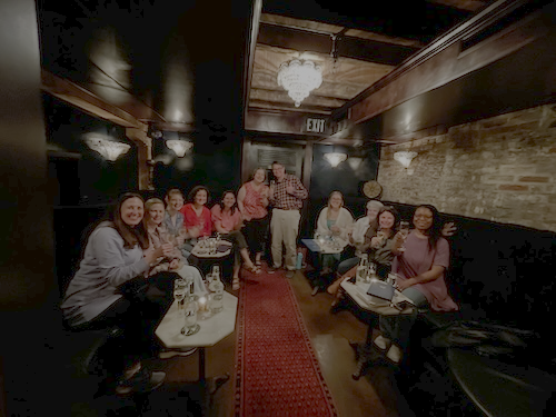 Group of Spalding students at a restaurant
