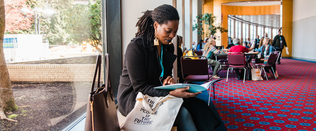 Image of an attendee sitting and reading at #AWP19.