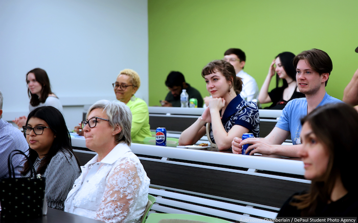 Close-up of people listening to panel