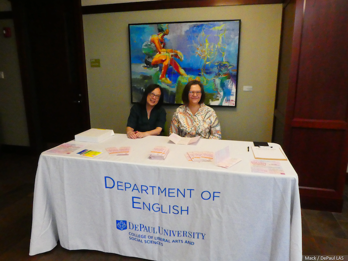 Two people staffing DePaul English Department table