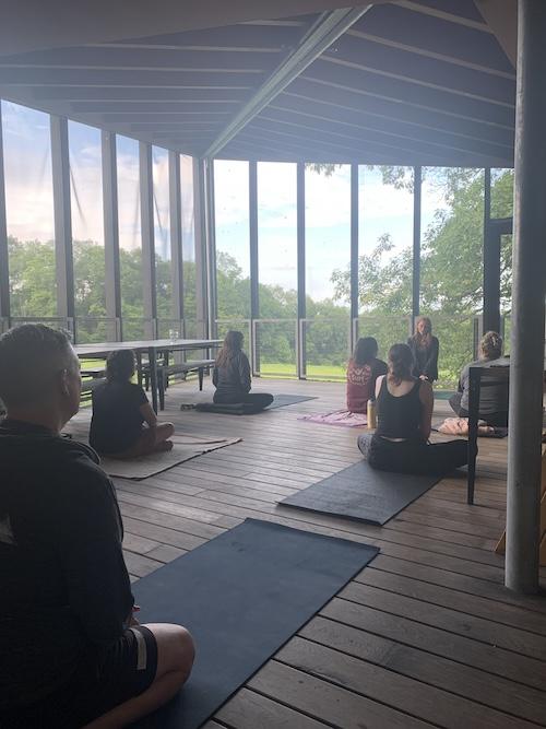 People doing yoga in screened-in room