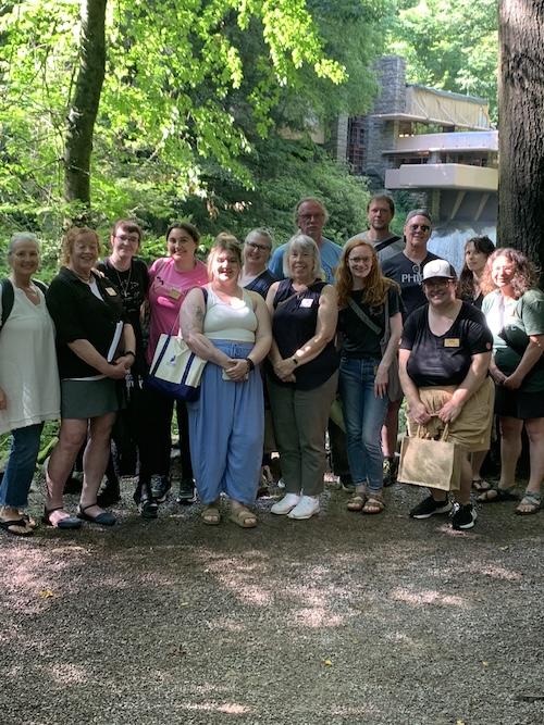 Group of people posing in front of Fallingwater